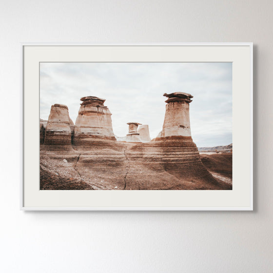 Art and Photography by Diana - Artwork - Columns of Earth, Drumheller, located in Southern Alberta - As rain washes away dirt and wind swirls around rocks, the hoodoos rise above all else